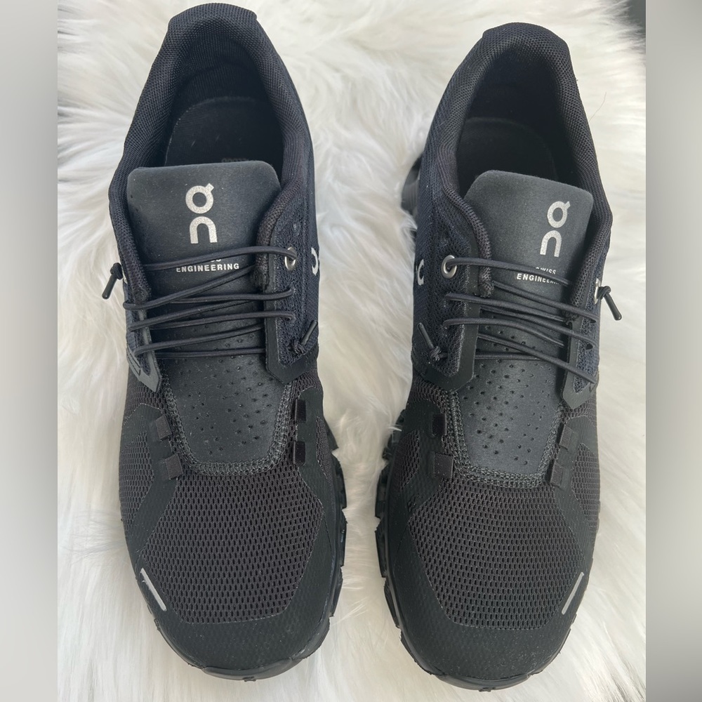 Cloud 5 All Black Womens 9.5. Gently worn 2-3 x tad too big. Purchased 11/2023